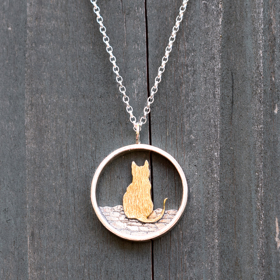 gold and silver cat necklace
