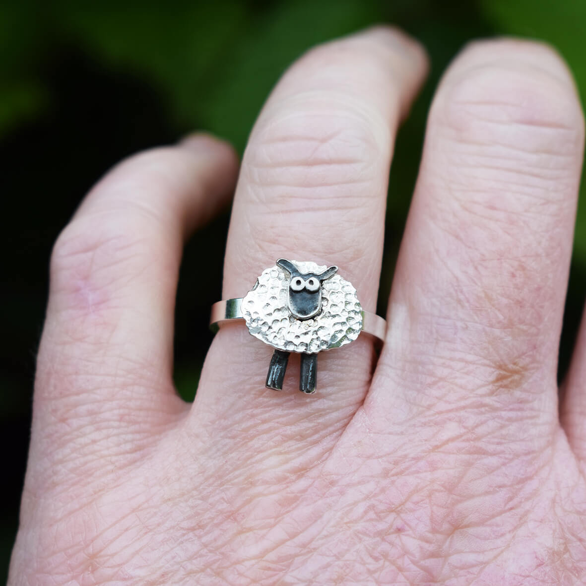 silver sheep ring on finger, shaun the sheep style silver ring, silver sheep jewellery