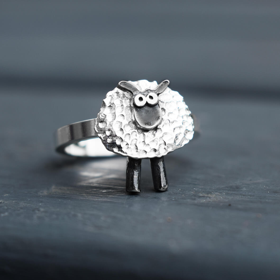 silver sheep ring on finger, shaun the sheep style silver ring, silver sheep jewellery