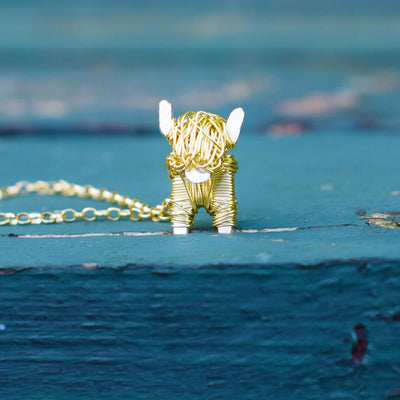 gold highland cow necklace, gold highland cow jewellery. gold cow